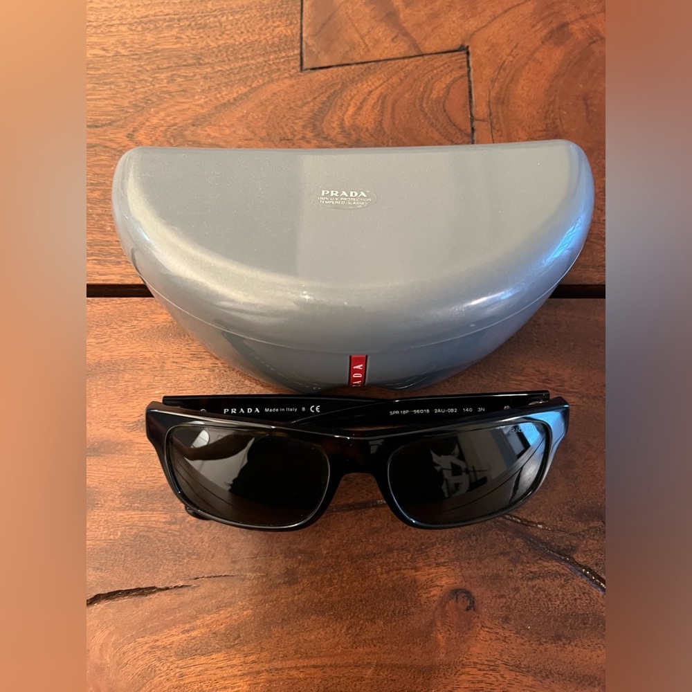 Prada Classic sunglasses with a contemporary rectangular design, mint condition.